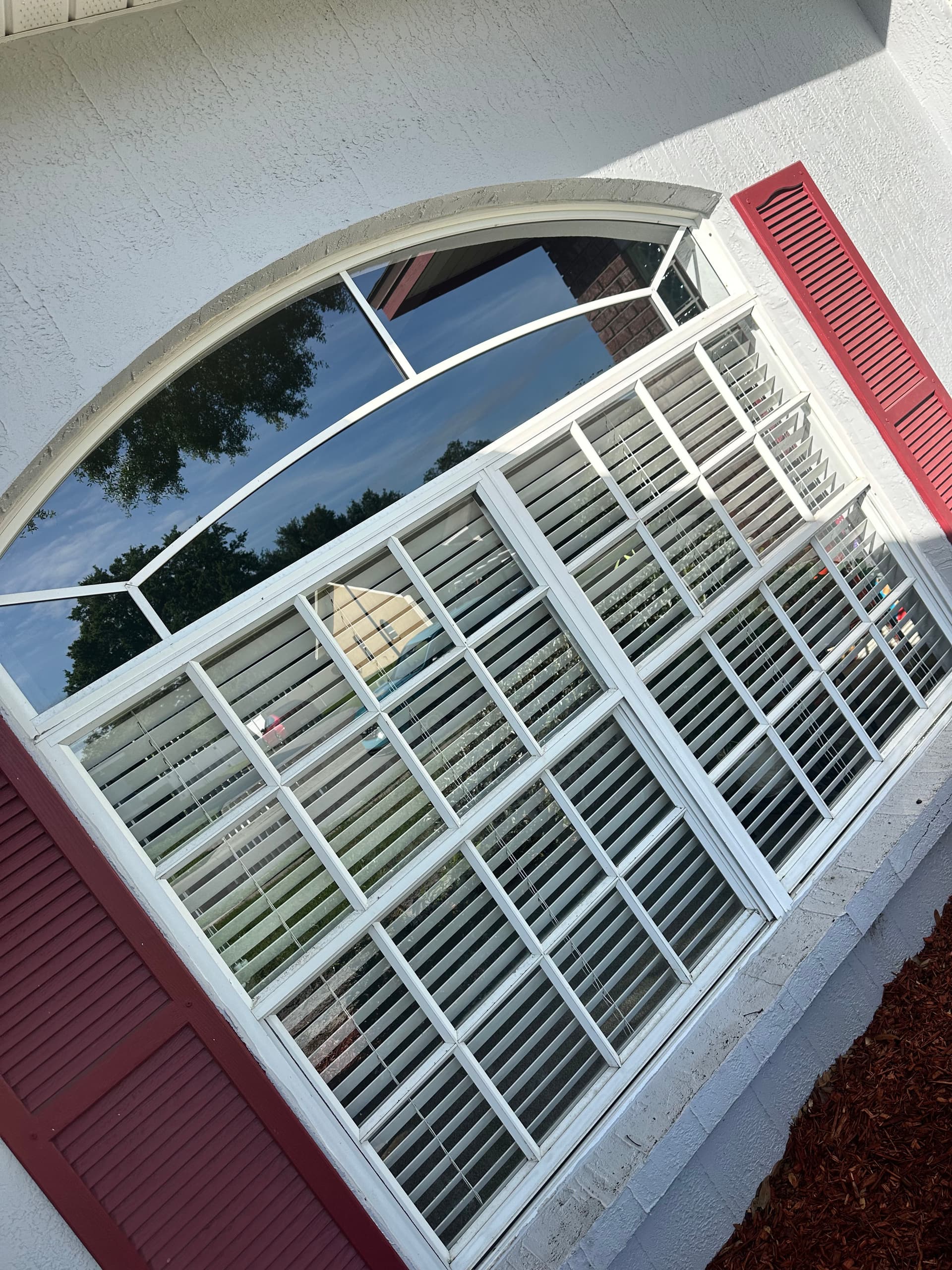 Exterior Window Cleaning on a Home With Stunning Arched Glass image